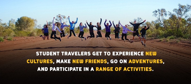 Student travelers jumping for joy in the Australian Outback