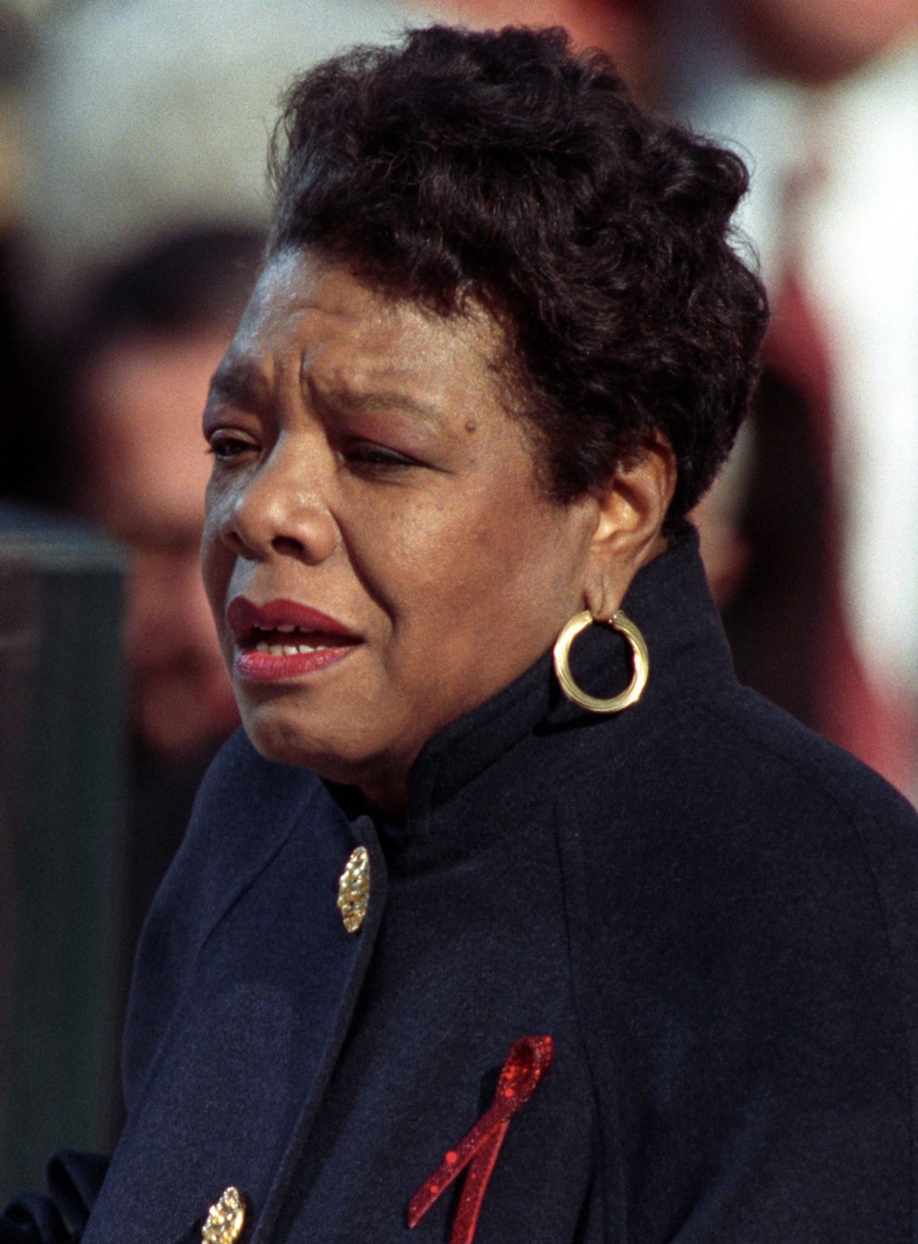 Maya Angelou, wearing gold hoop earrings, passionately delivers a speech. Her work reflects quotes about service learning, empowerment, and making a difference.