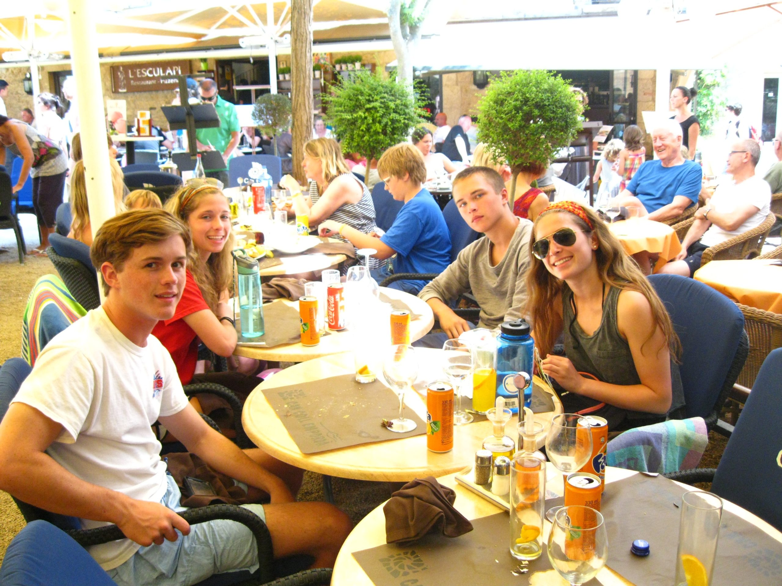 Students sitting together at an outdoor cafe
