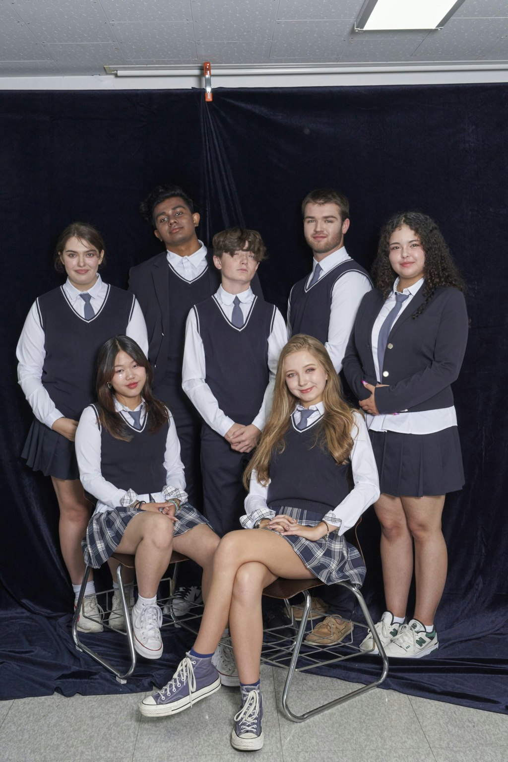 Rustic Pathways students wear school uniforms and pose for the camera after their K-pop idol makeovers.