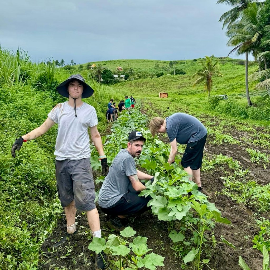 cas trips students doing farm work 