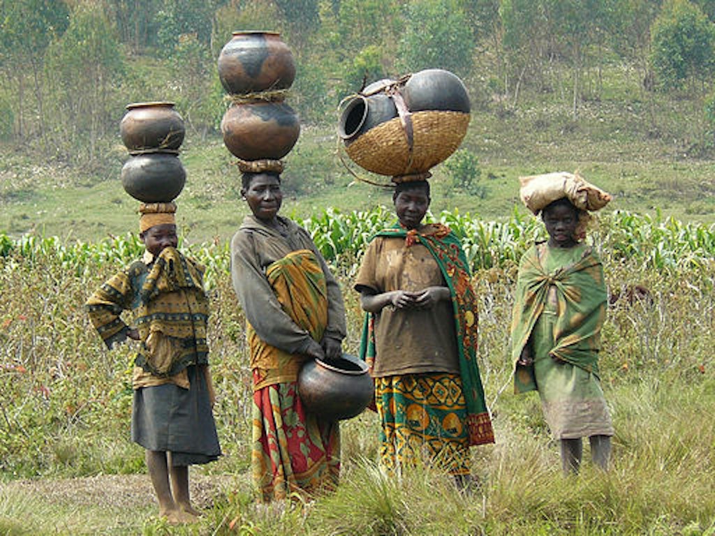 Batwa women in Burundi watch a community event.