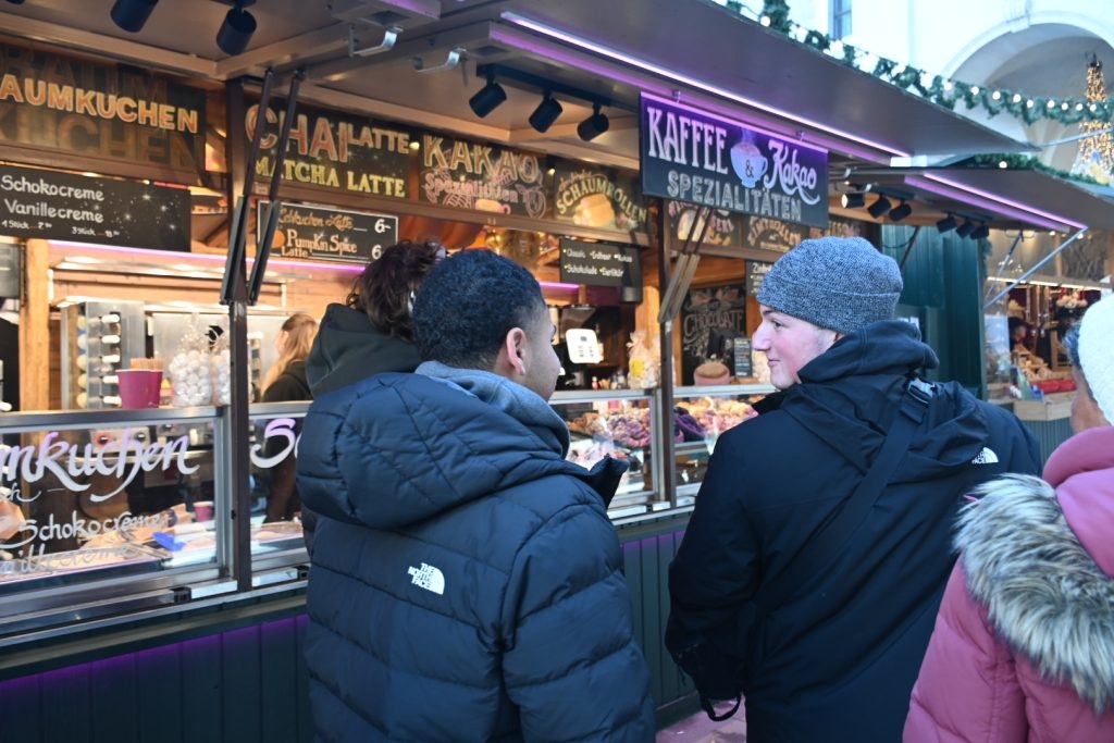 A group of students visit a German market during a teen tour to Italy and Germany.
