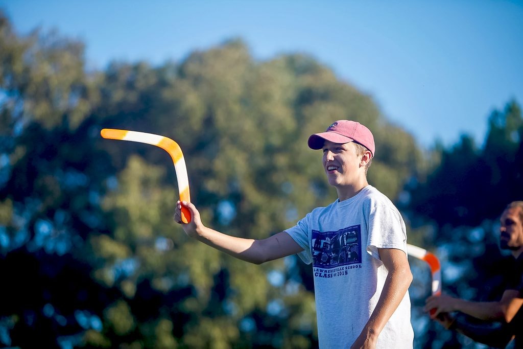 student traveler throwing a boomerang during a teen tour in Australia