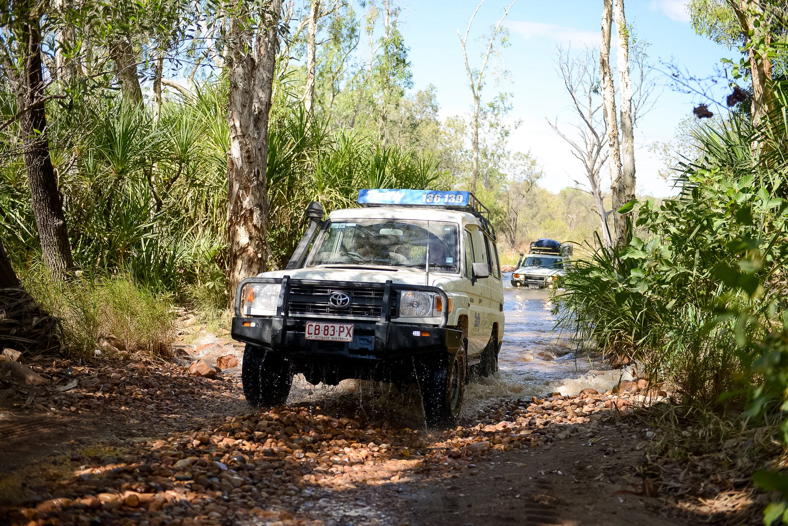 jeeps drivign through mud on a school trip to austral