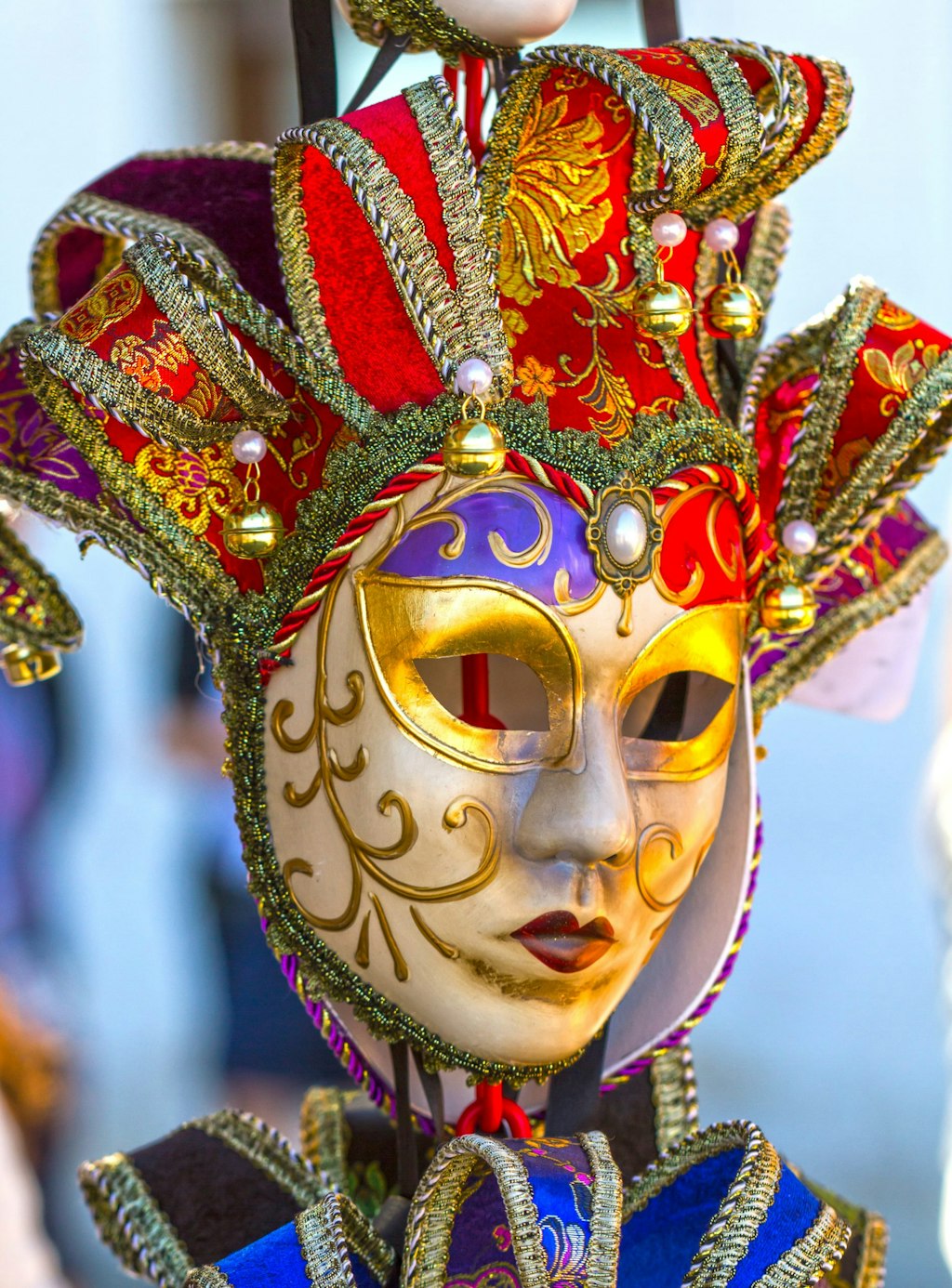 A close-up shot of a colorful Venetian mask.