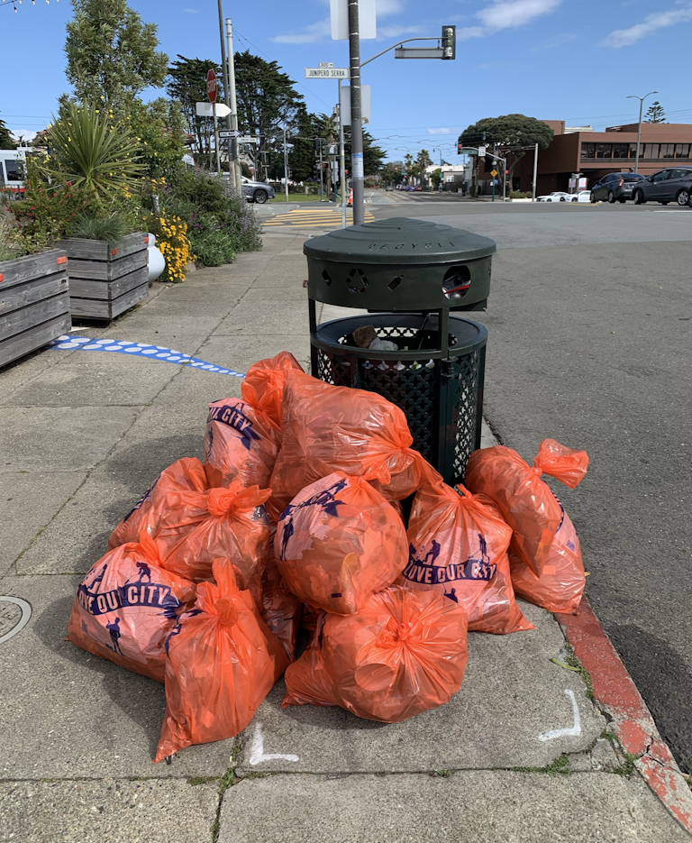Trash bags collected during the cleanup event.