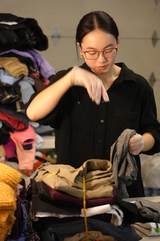 Audrey ensuring all donations are in good condition.