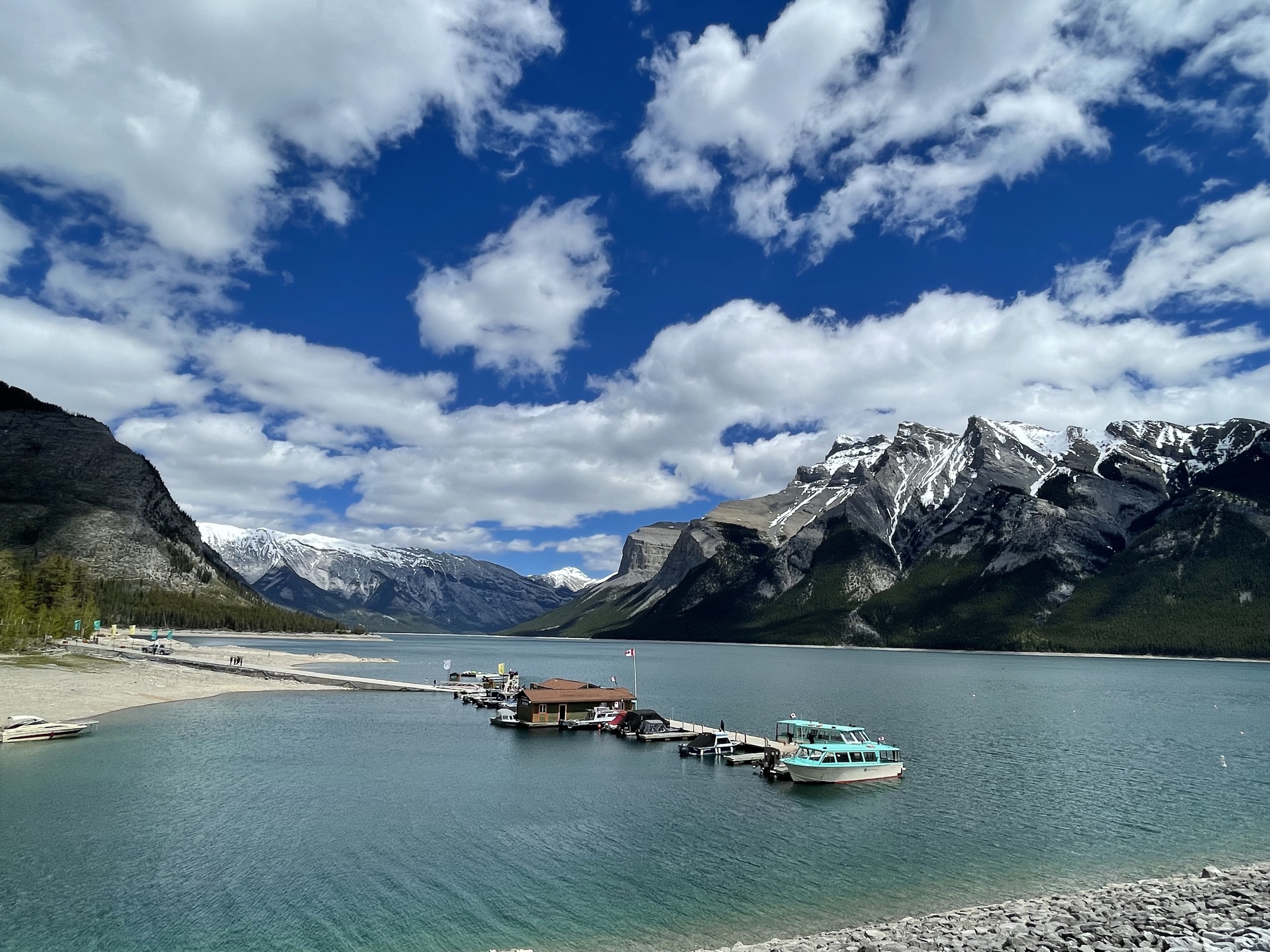 Lake Minnewanka's turquoise water beneath the peaks of Banff National Park.