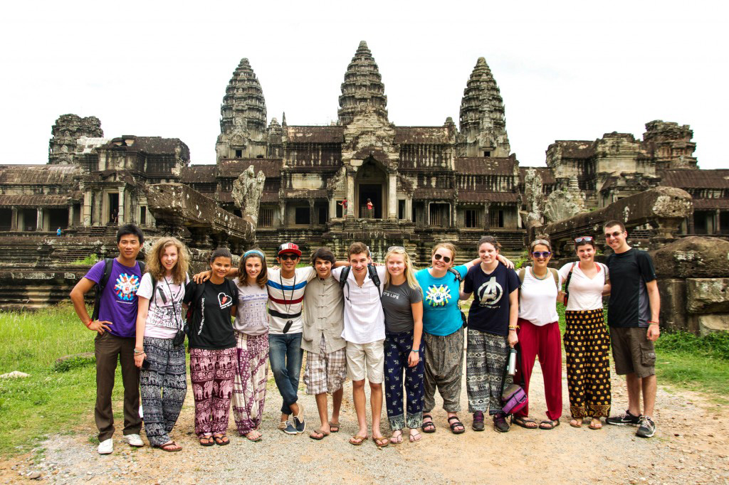 Students pose in front of Angkor Wat's towers