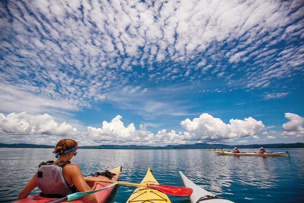 Students kayaking on calm waters during Rustic Pathways summer volunteer abroad programs in Costa Rica