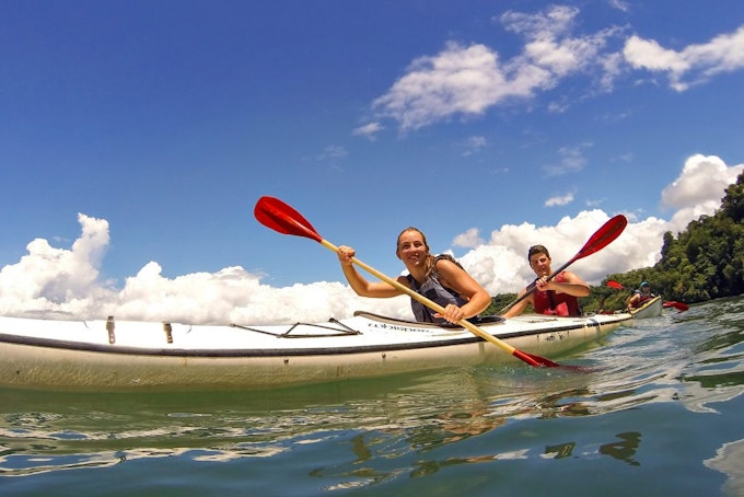 Students kayaking down a river during a guided travel program in Costa Rica