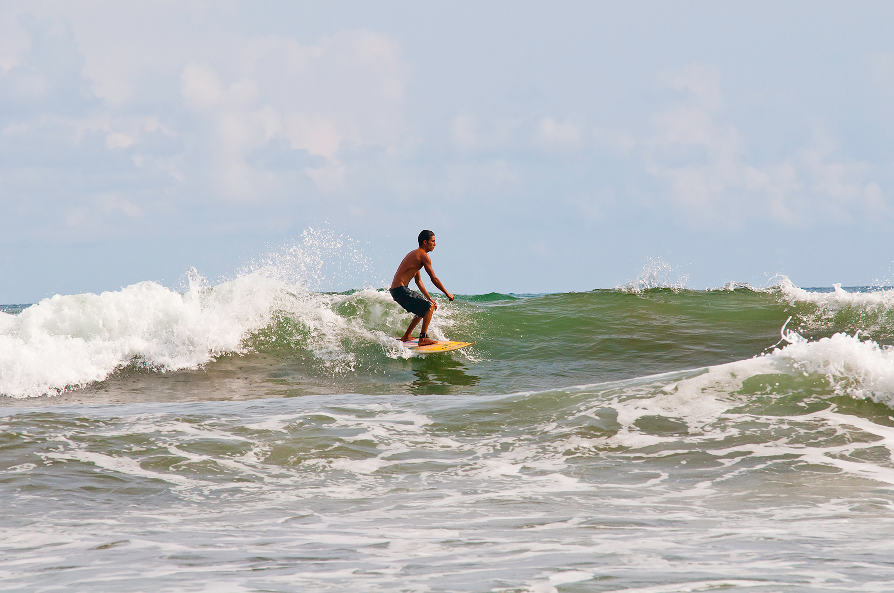 Picture of person surfing on the ocean.