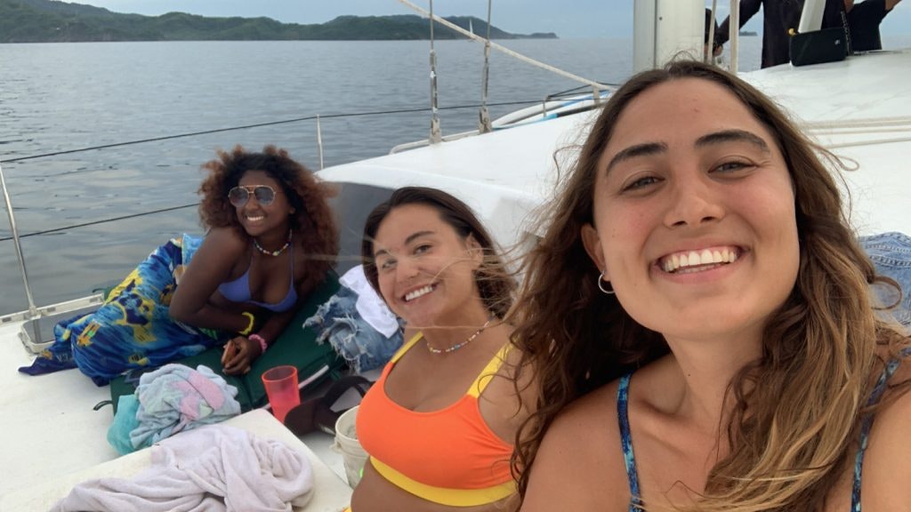 Janae (left) enjoyed hanging out with the program leaders during her Rustic Pathways program.