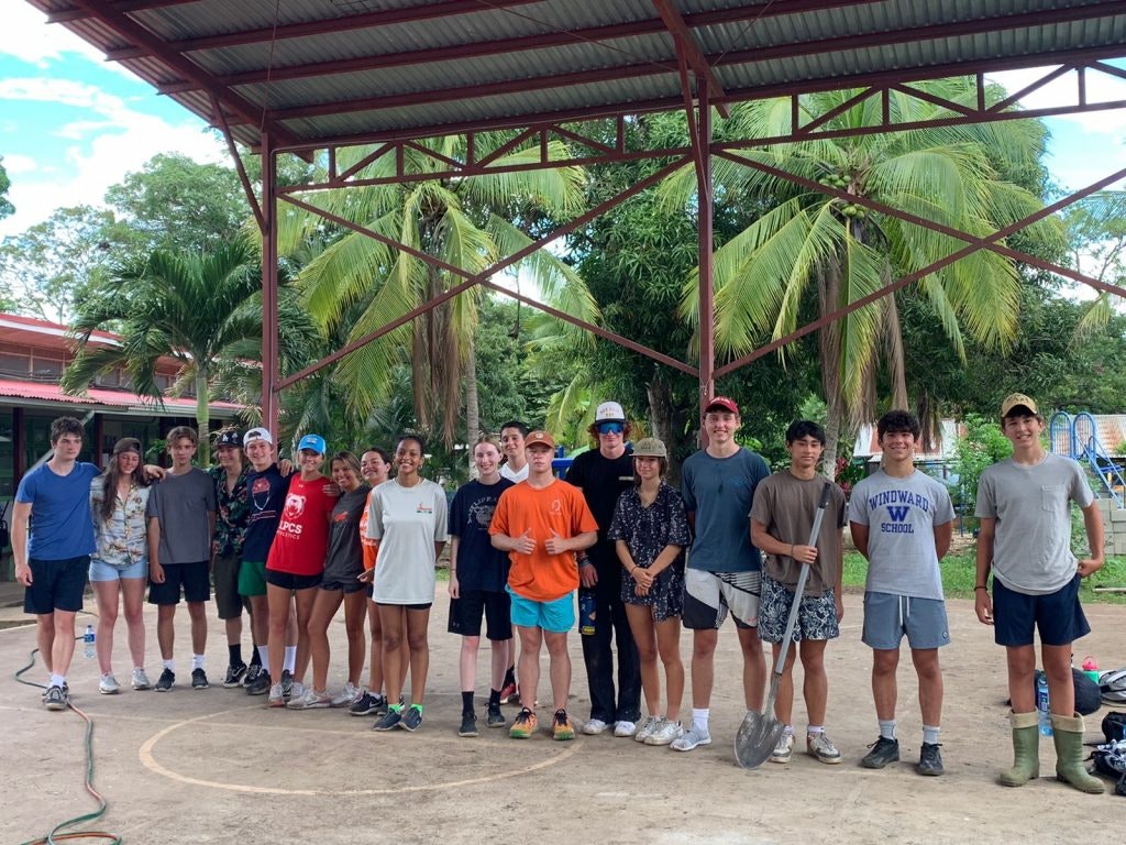 Rustic Pathways students take a break from service.