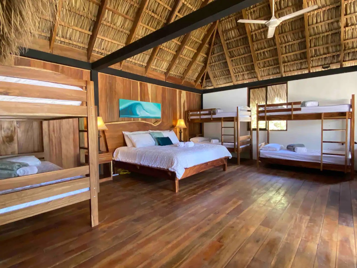 Picture of bungalow with view of beds and ceiling.