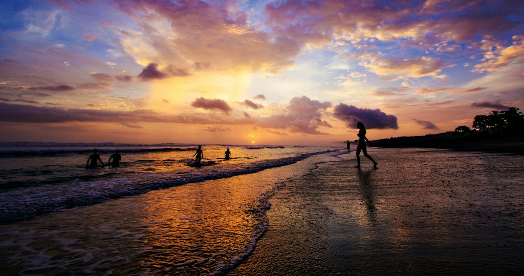 Students enjoying a beach sunset after a day of service during Rustic Pathways first-time volunteer abroad program in Costa Rica