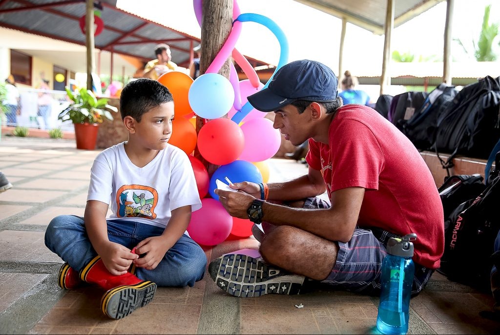 A Rustic Pathways student spends time with local children in La Fortuna, Costa Rica.