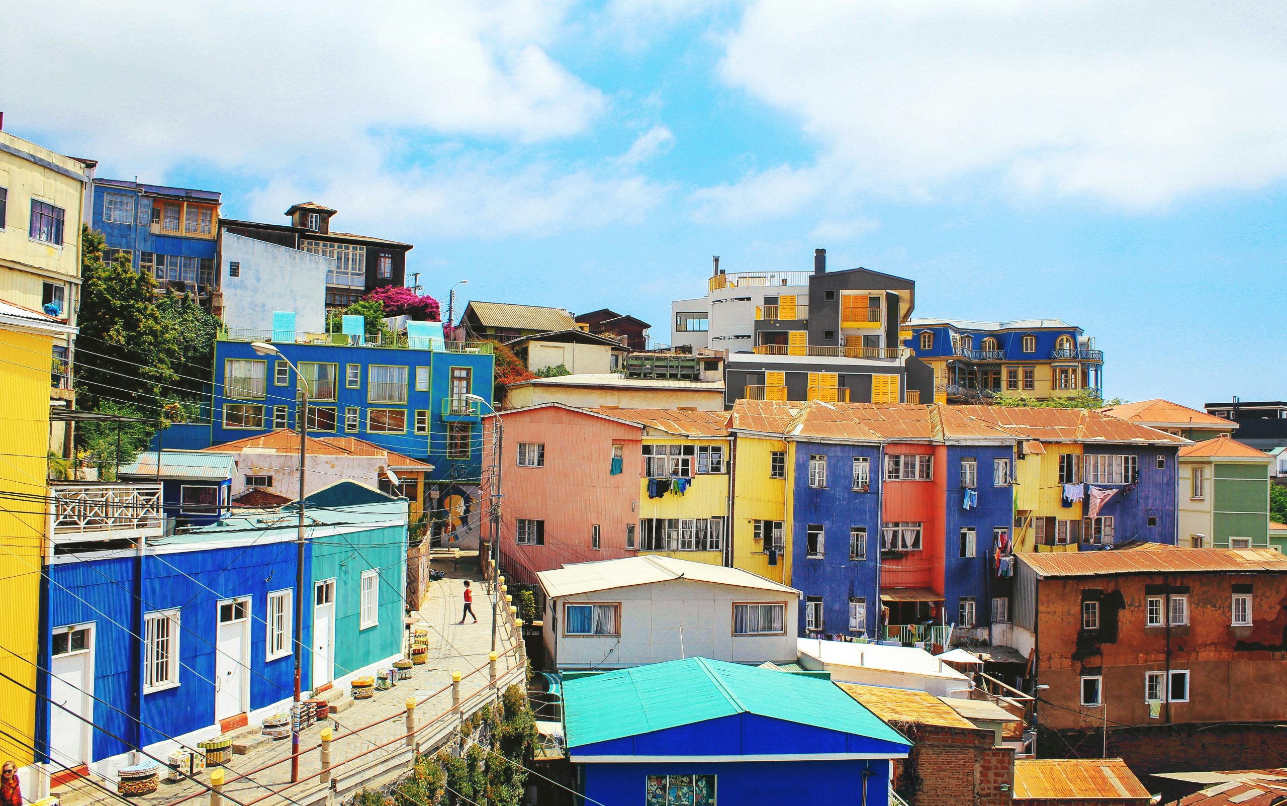 Bright and colorful town in Chile with many buildings and a clear sky.