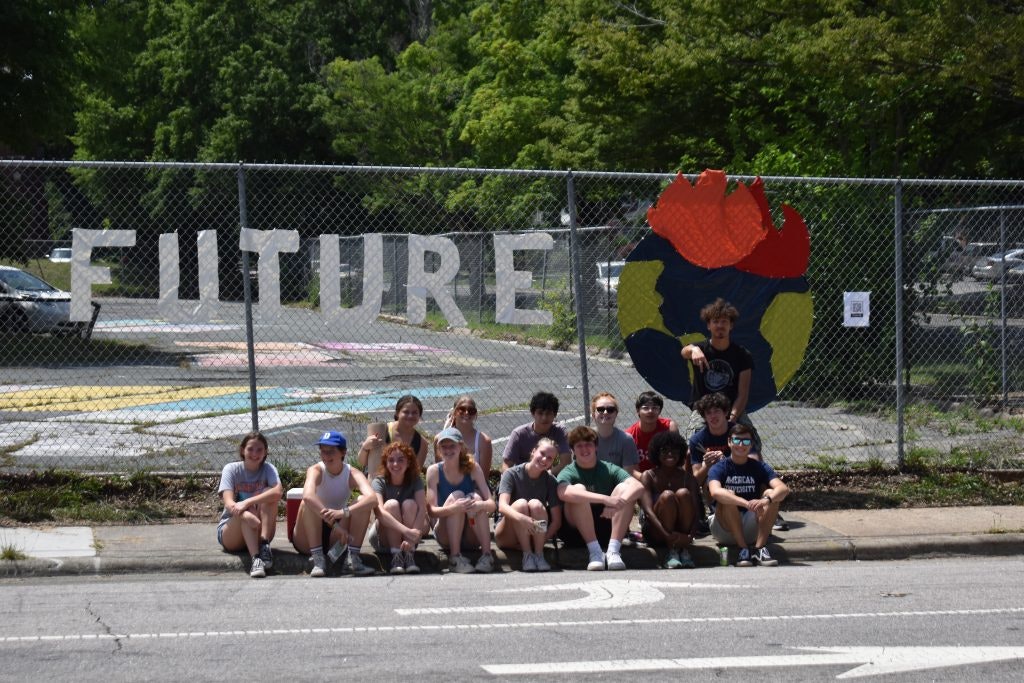 Rustic Pathways student Ella Perin and her classmates made a display to draw attention to environmental issues.