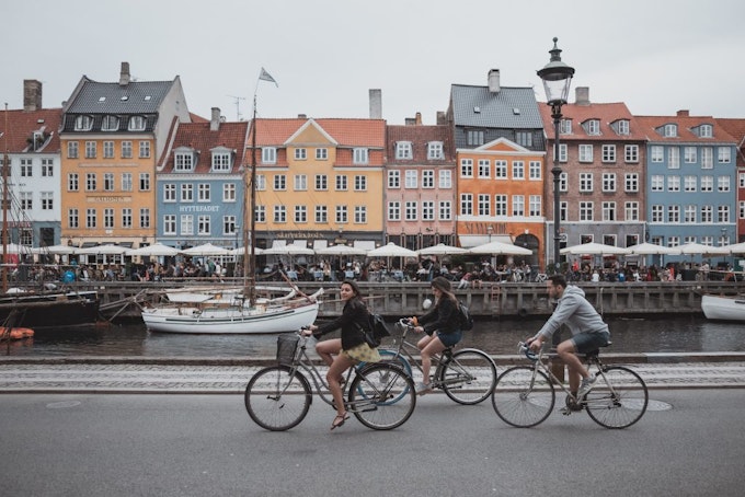 Students cycling through the streets of Denmark during a travel program