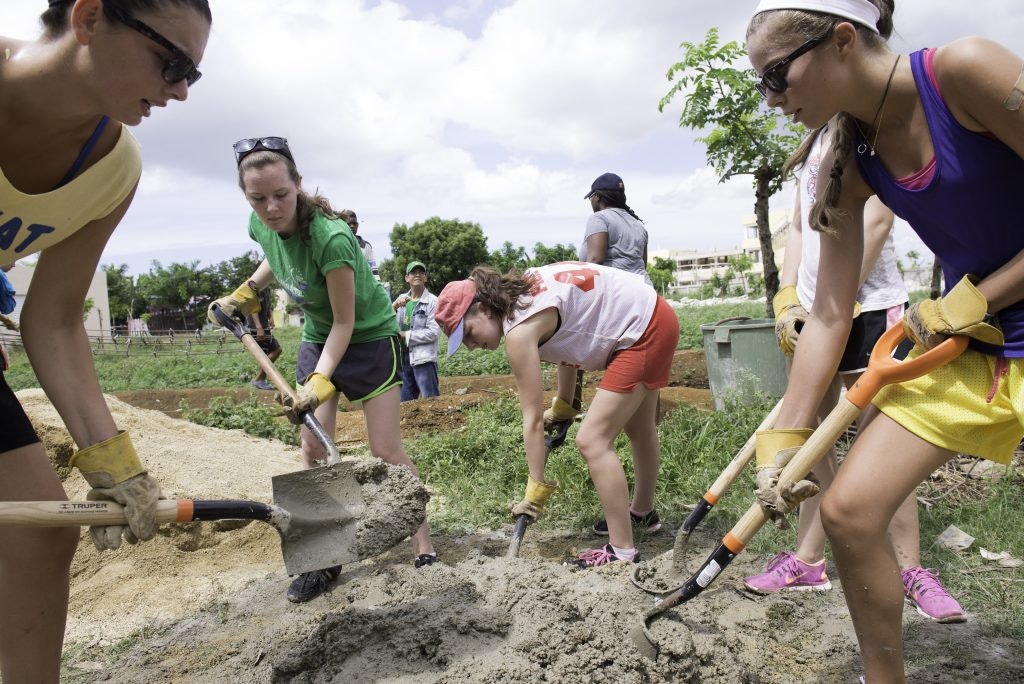 Rustic Pathways students doing construction work during a service learning project in the Dominican Republic.