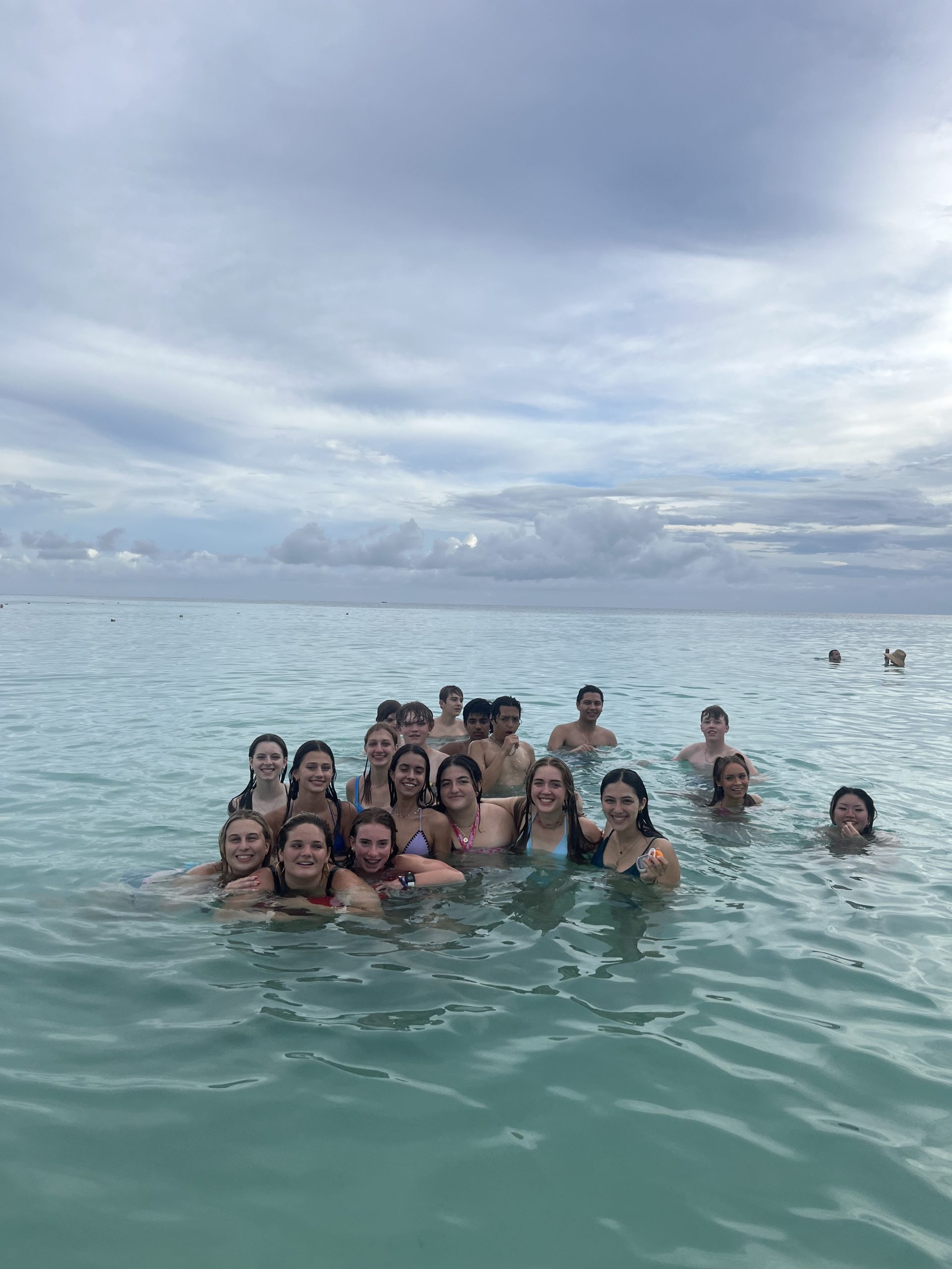 Visa-free travel in the Dominican Republic: Group of people swimming in the ocean near the Dominican Republic