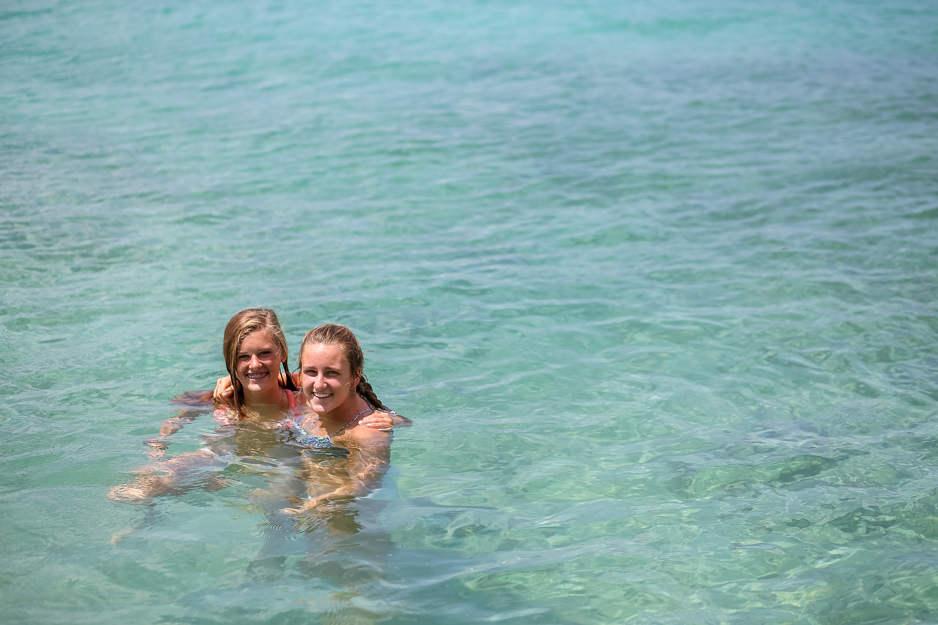 Students swimming in the clear waters of the Dominican Republic