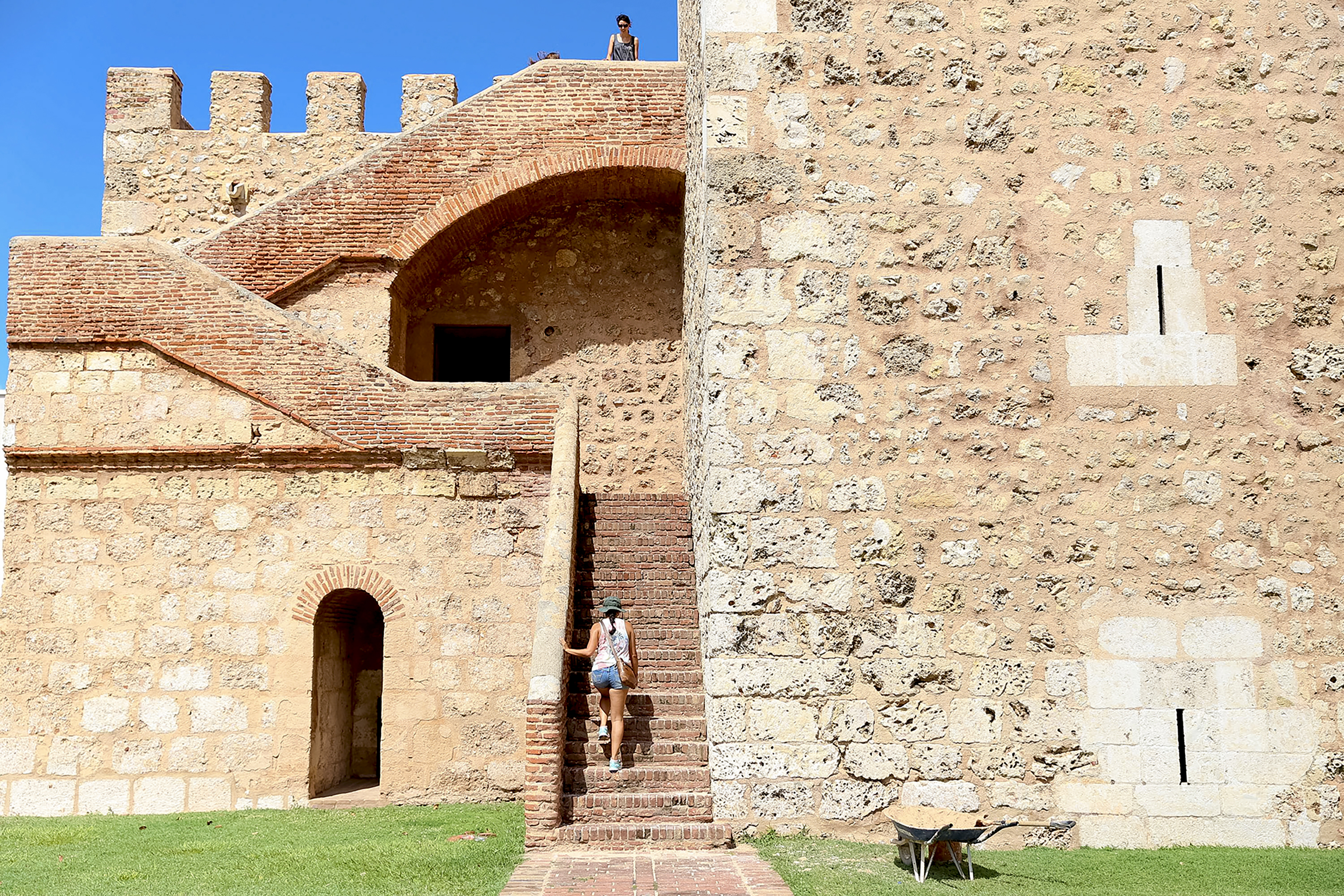 A student descends stone stairs at a historic stone fortress