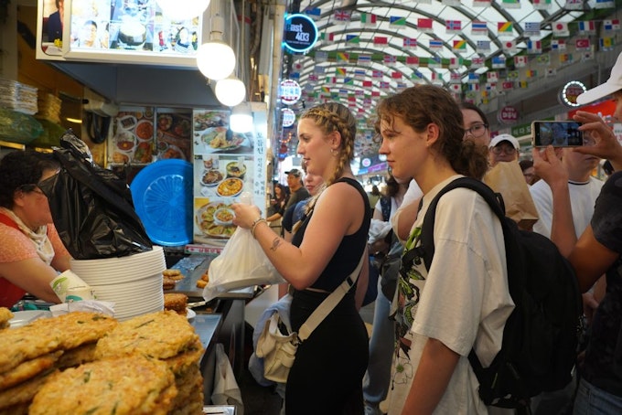 Students exploring a traditional market in Seoul during a teen travel program to South Korea