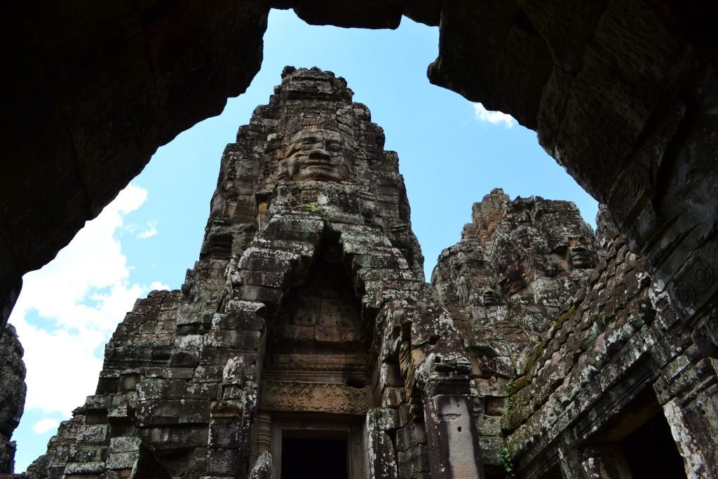 Ancient temple ruins with stone carvings and statues.