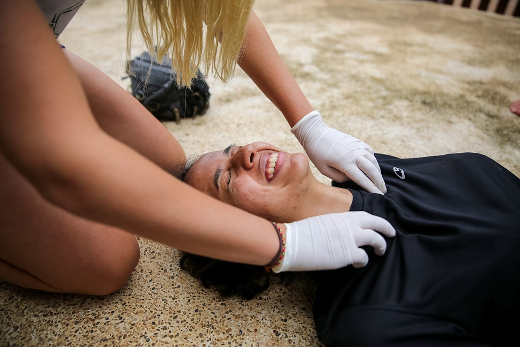 Rustic Pathways program leader demonstrating first aid response during staff training