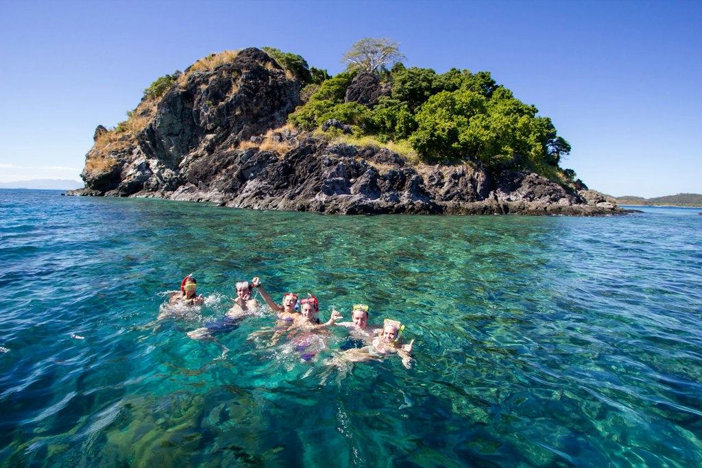 Students snorkeling near a tropical island, demonstrating what to expect on a Rustic Pathways student travel program filled with adventure, exploration, and unforgettable memories.