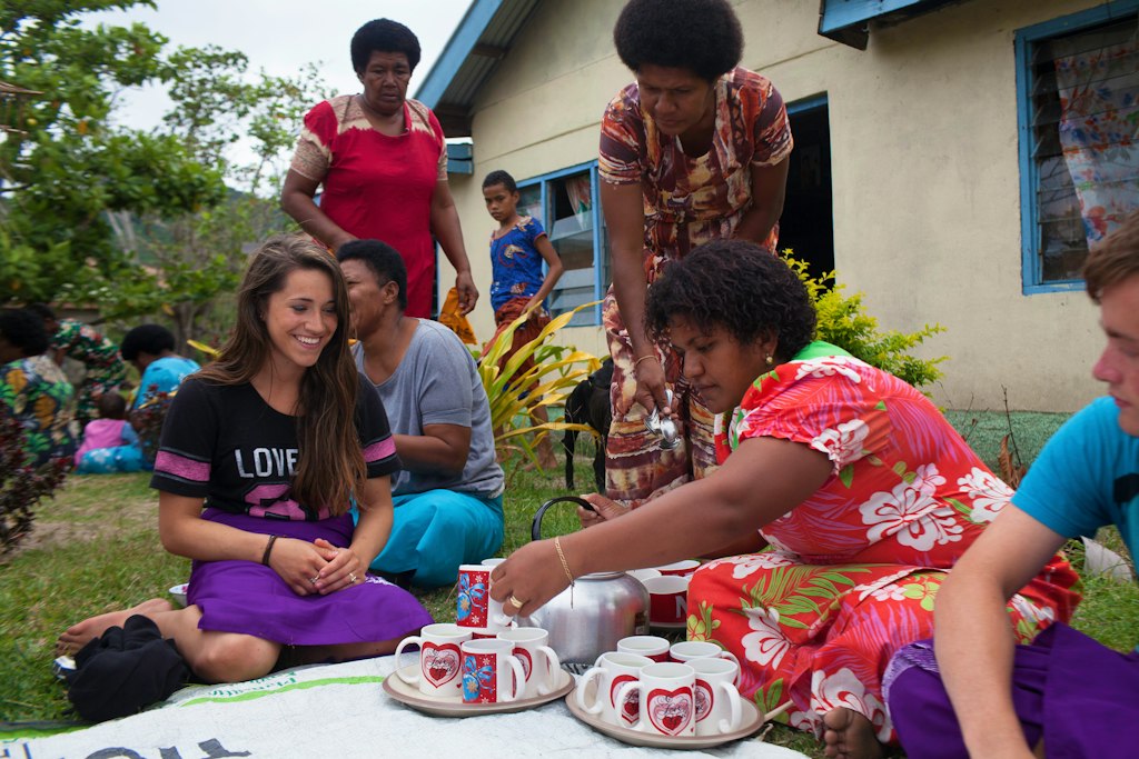 Students connect with locals over tea.