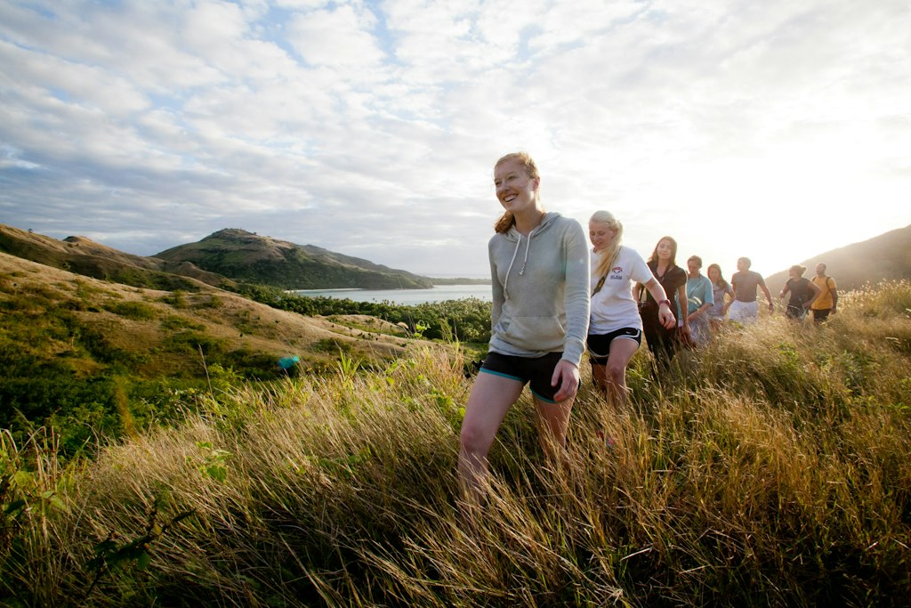 Students wander through the field.