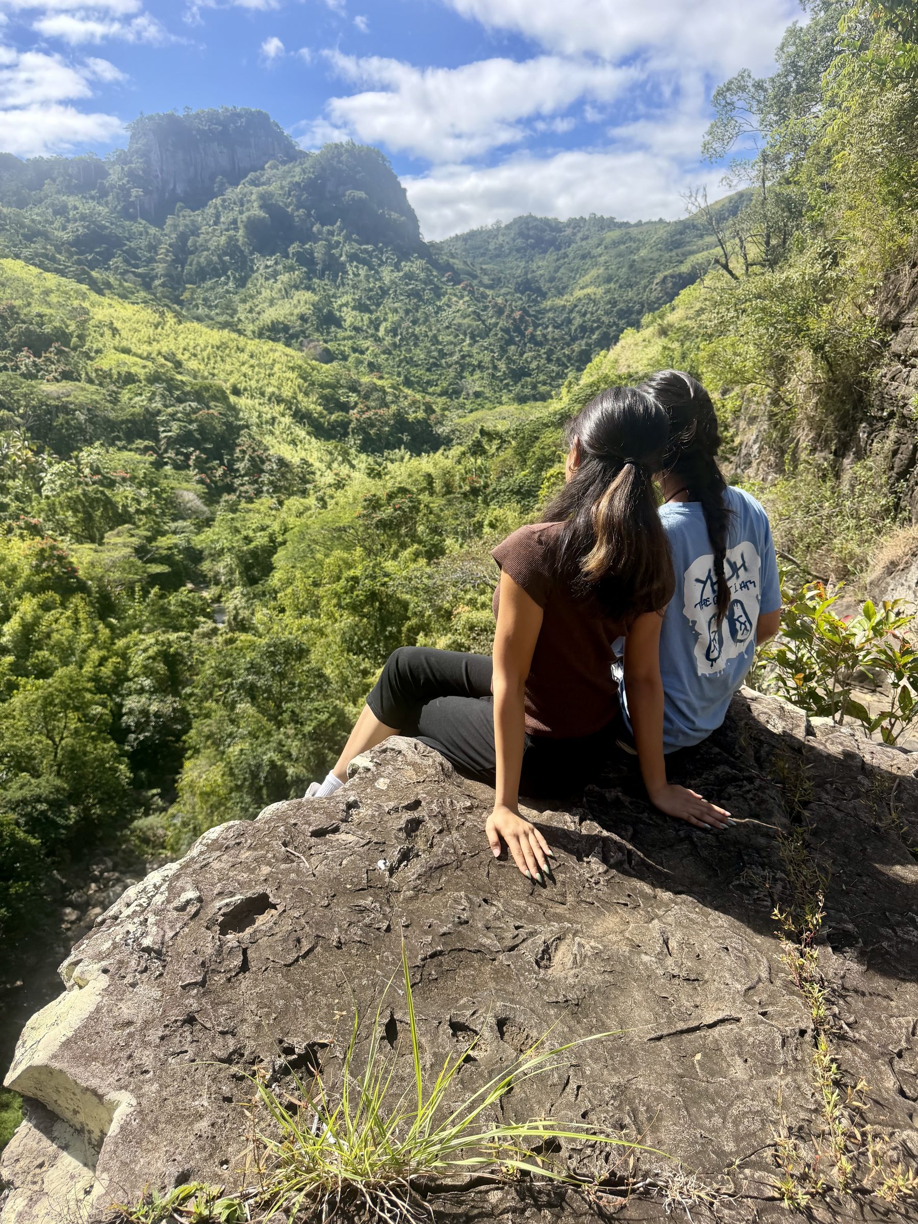 A student looks out over the green highlands of Fiji.