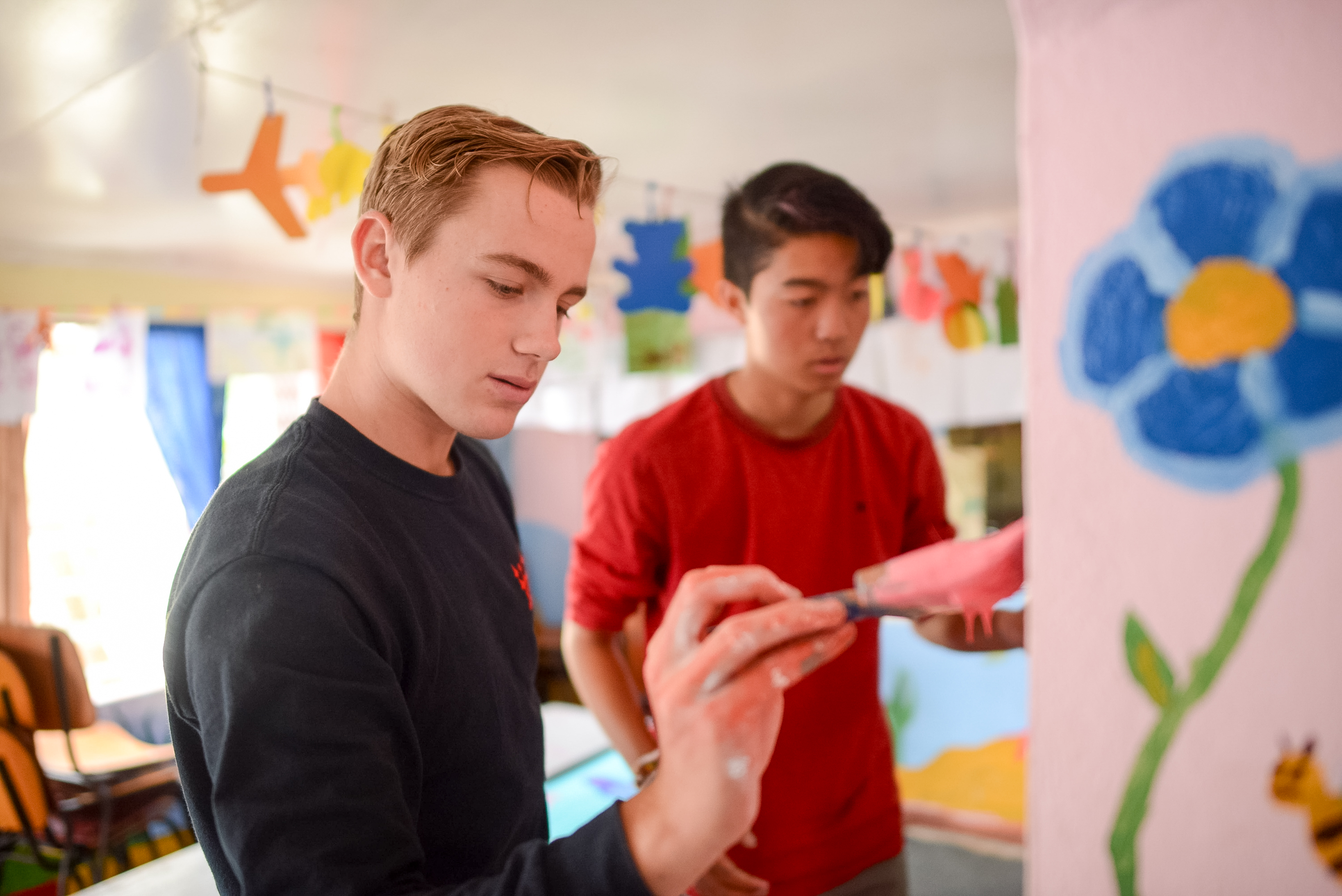 two boys working on on art project
