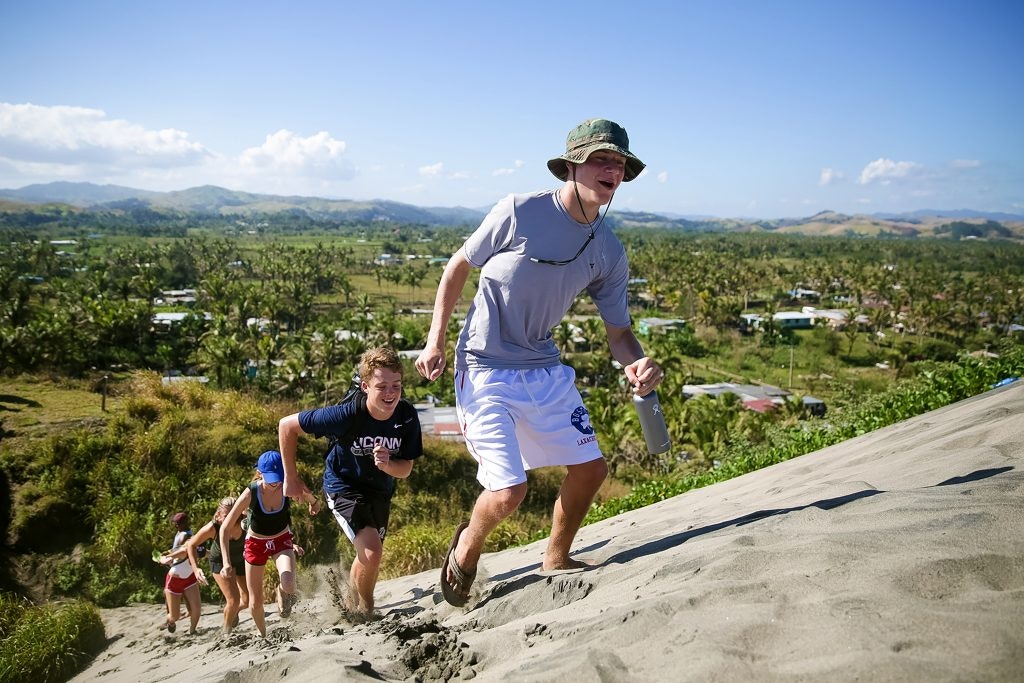 Take a break from service and climb some dunes in Fiji. Copyright: © 2016 Rustic Pathways