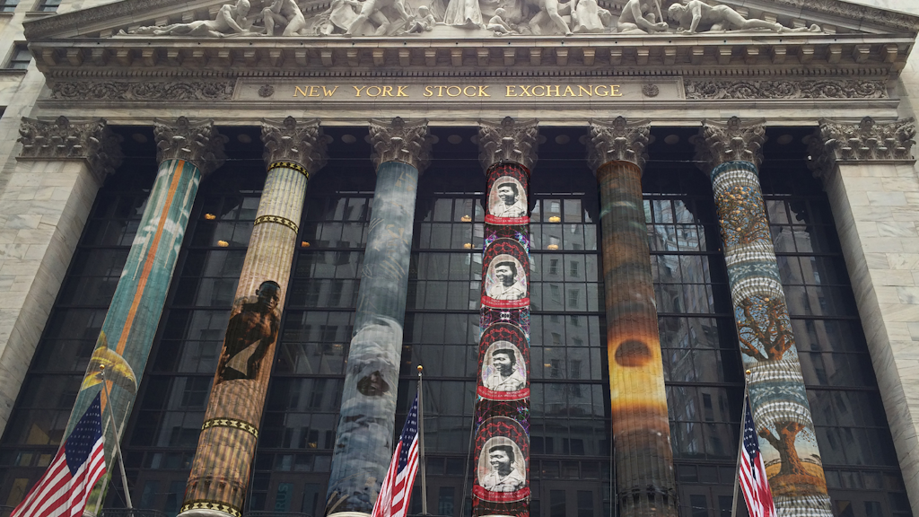 Afro-futurist projection on the NYSE columns