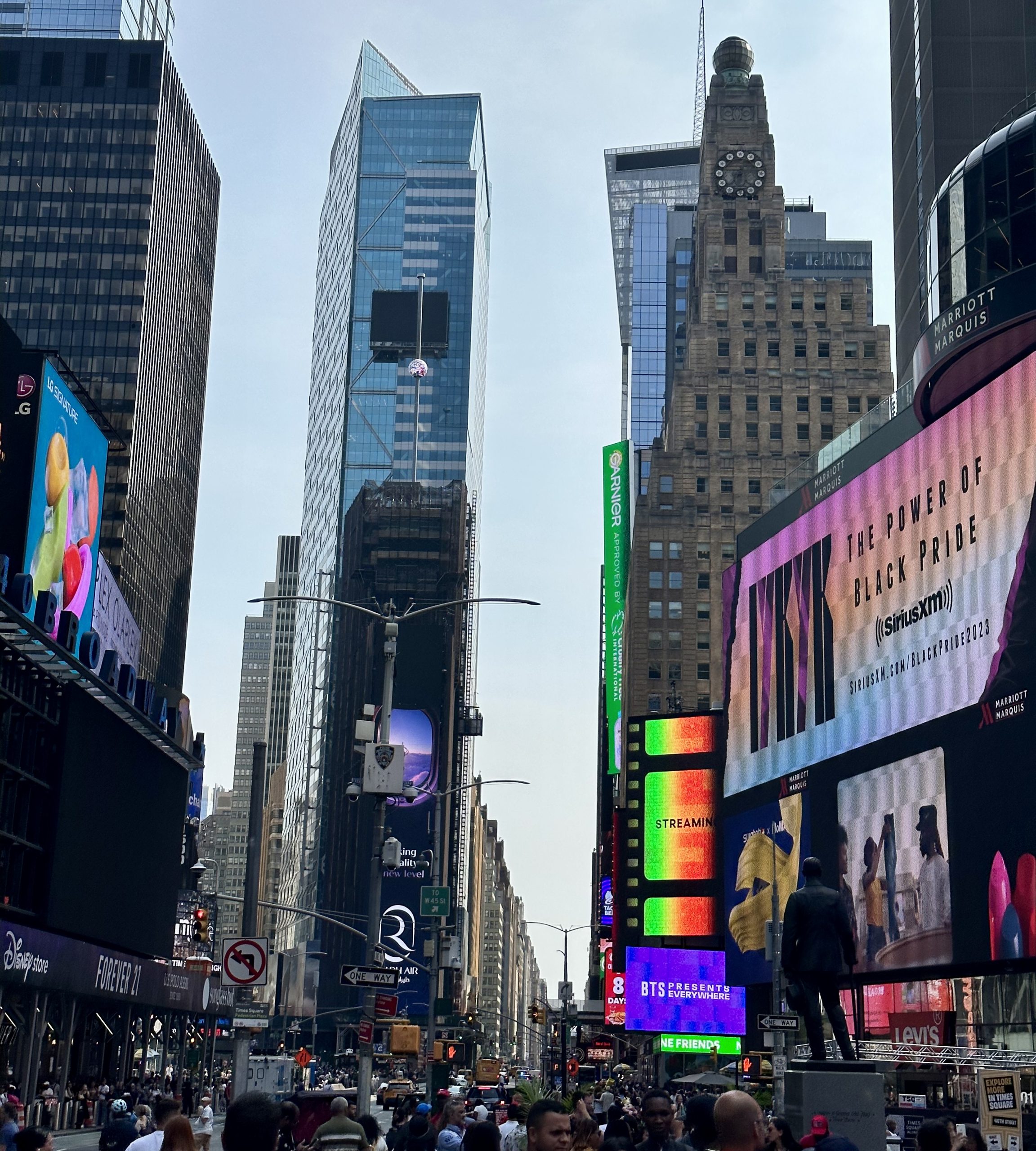 Towering skyscrapers and colorful billboards in Times Square, NYC.