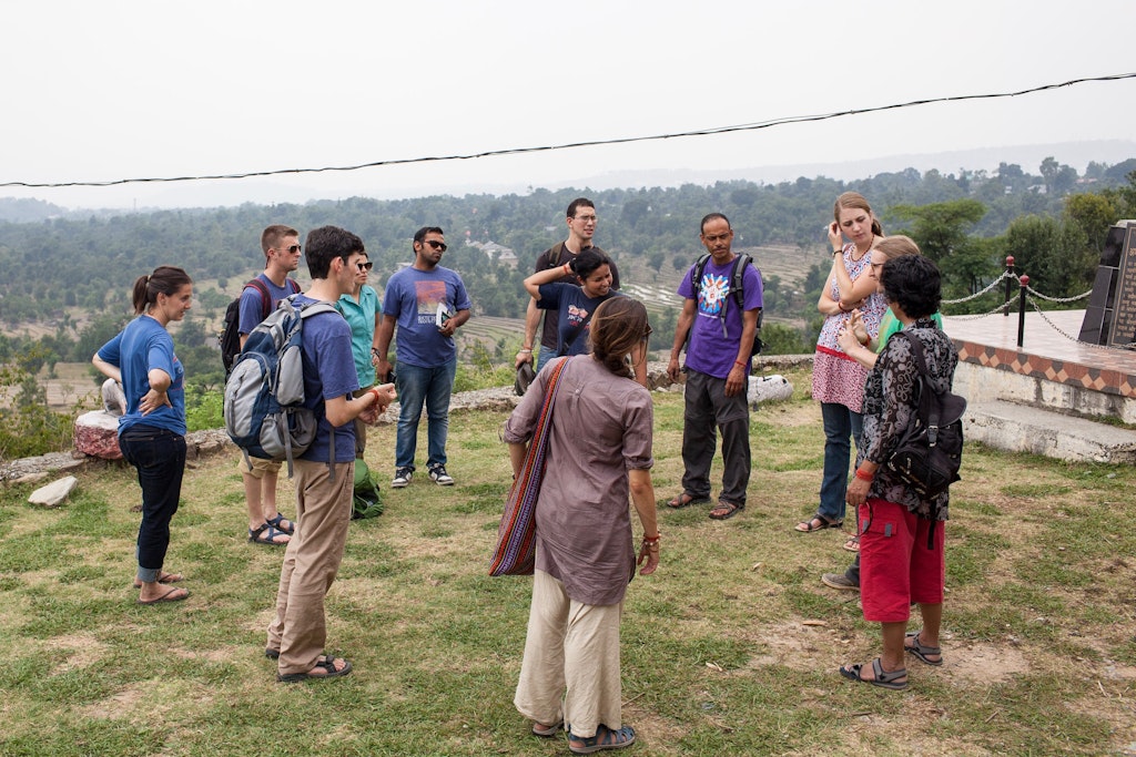 Rustic Pathways camp counselor staff training in India standing in the circle together.