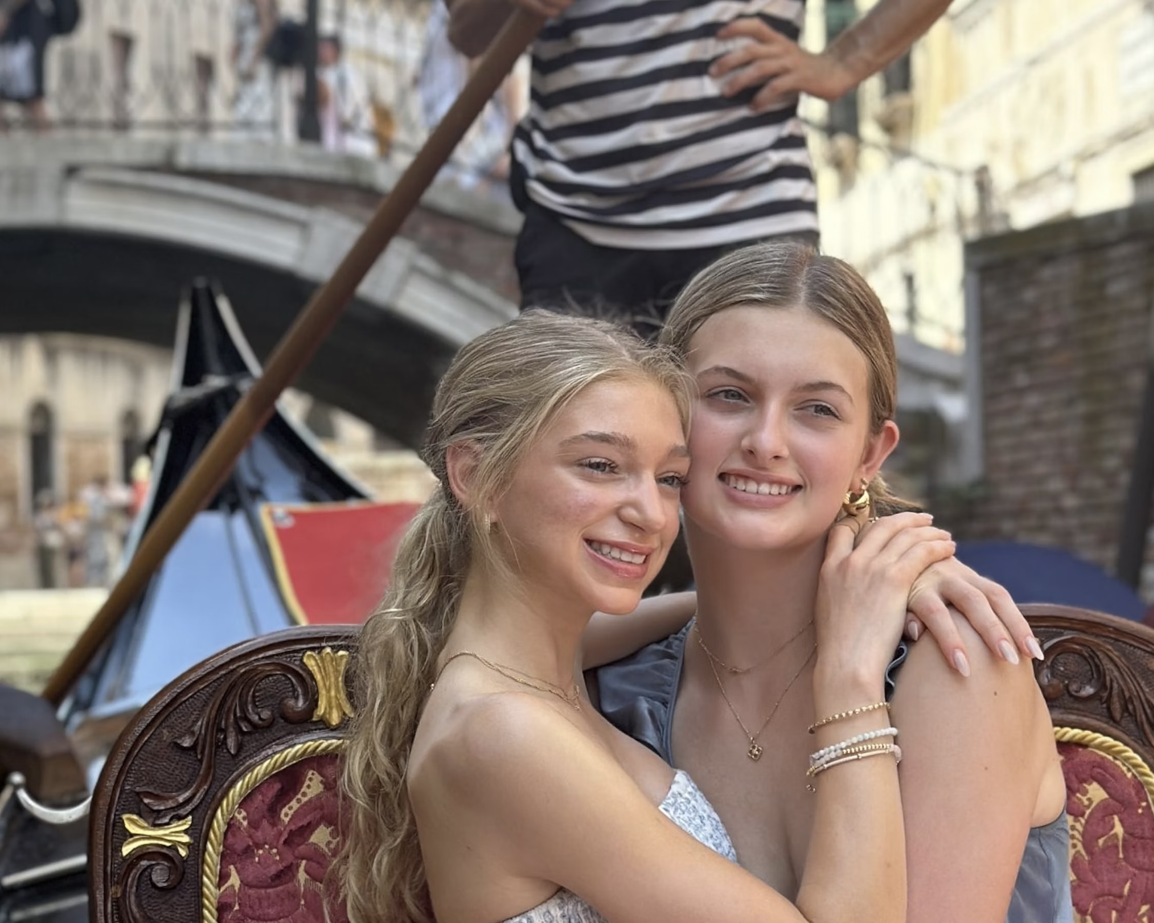 Two teen students smiling on a gondola ride in Venice during the Italy and Greece summer program