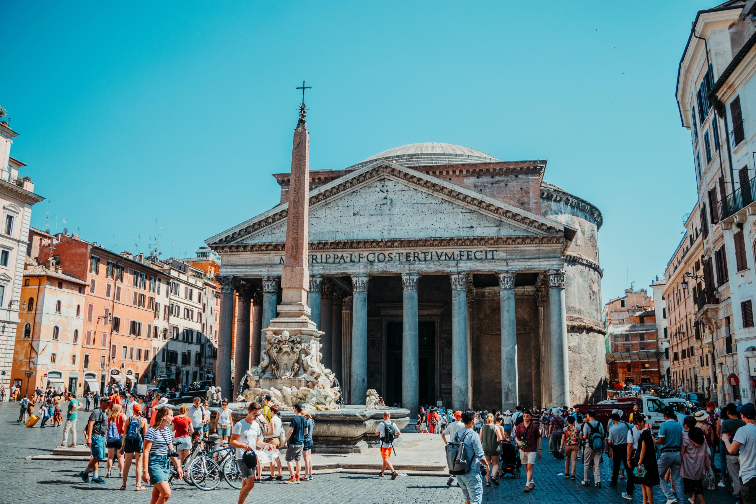 Teen travelers gather near the fountain in front of the Pantheon in Rome