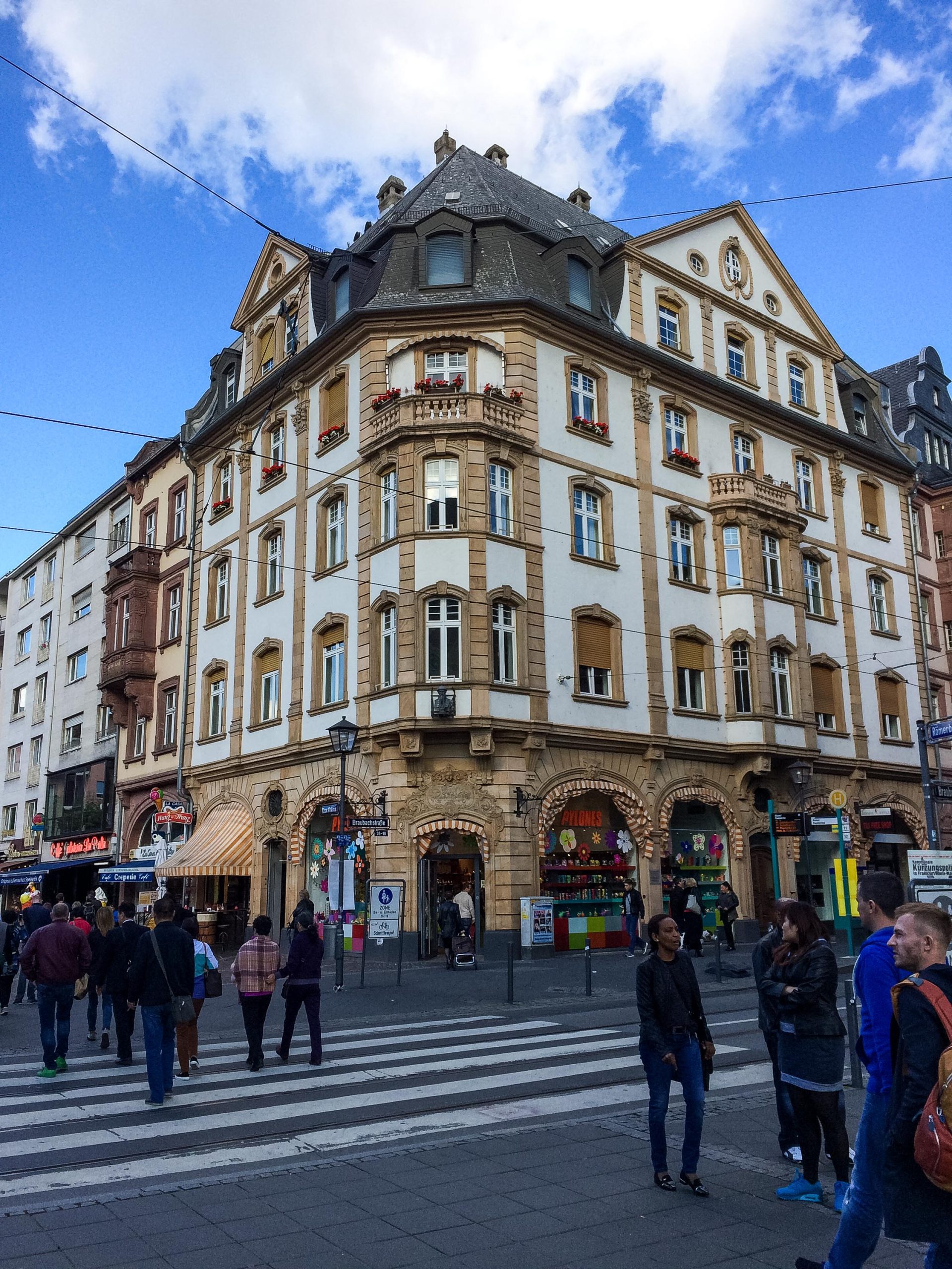 fun facts about germany. Street view of a historic building in Frankfurt with people walking