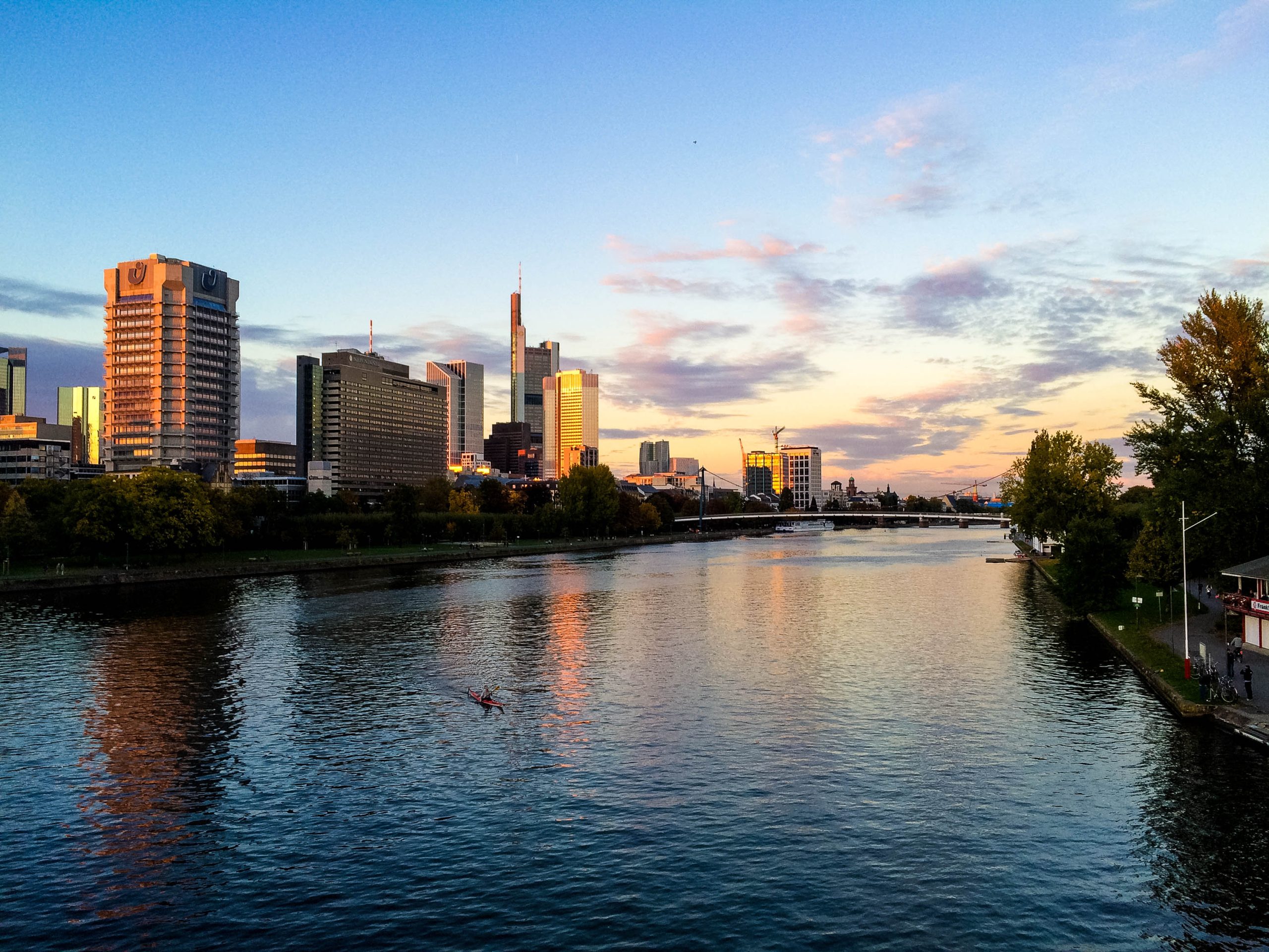 Skyline of Frankfurt at sunset with reflections on the river