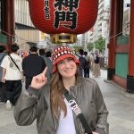 A person posing for a picture in Japan.