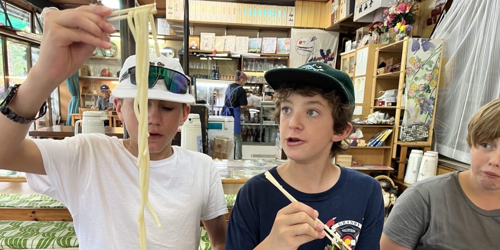 Japan Teen Tours & Summer Programs for High School Students enjoying a traditional dinner, highlighting daily life, cultural food experiences, and teen travel.