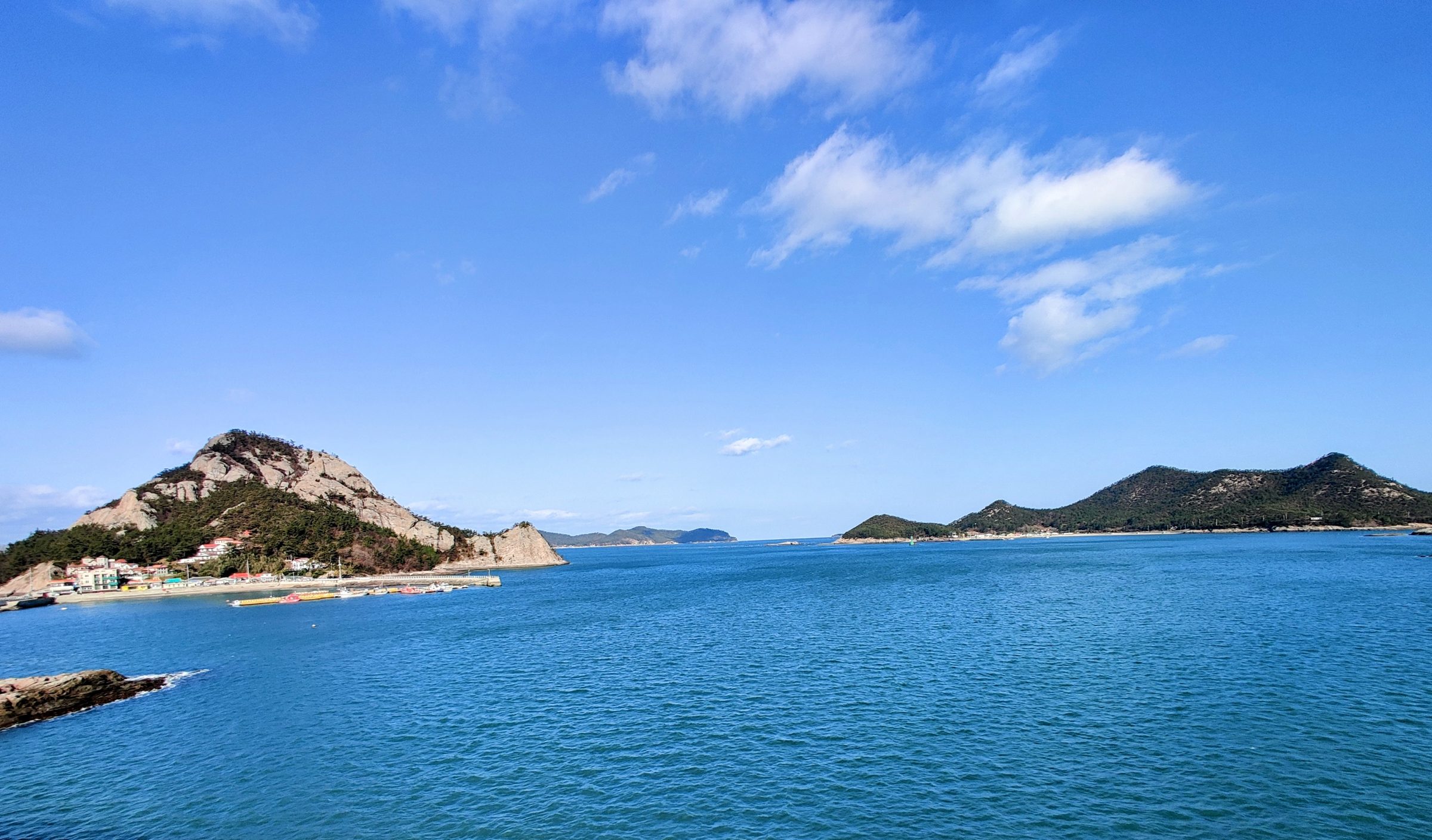 The Yellow Sea off Korea's west coast, islands low on the horizon under a clear sky