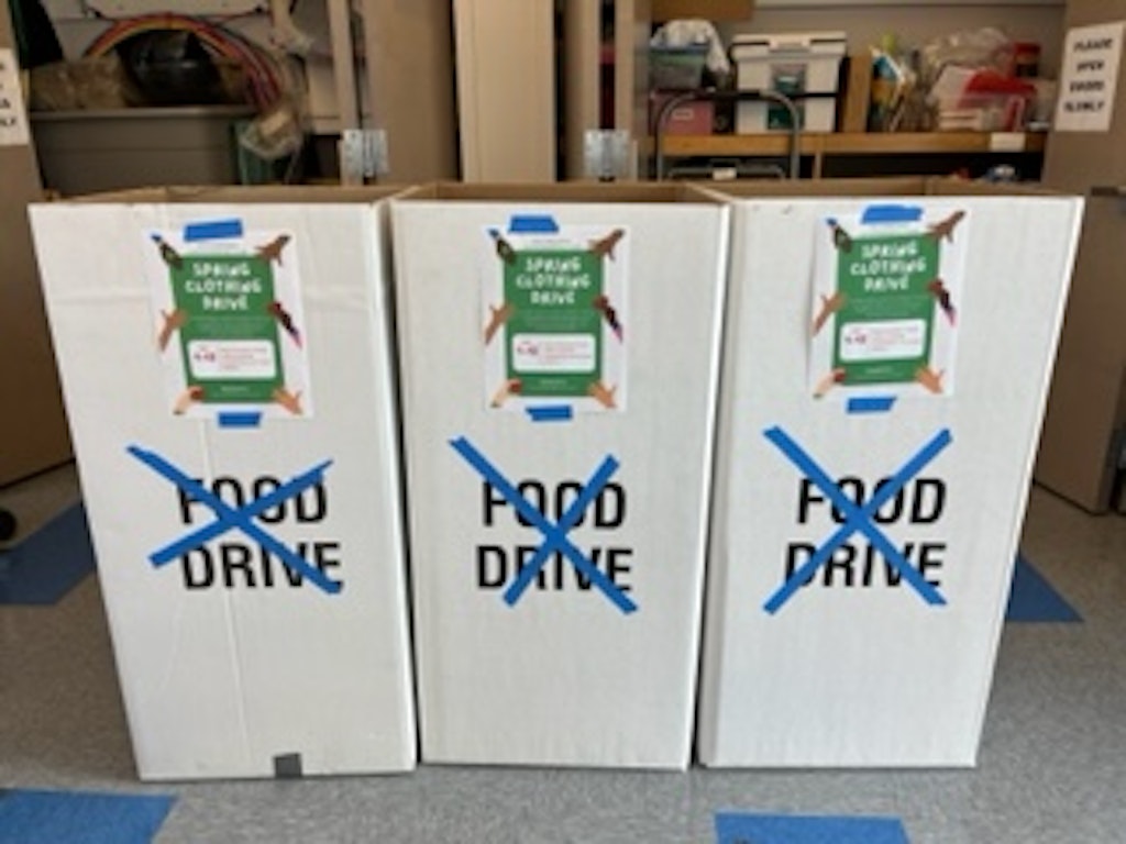 Clothing drive receiving boxes at a school