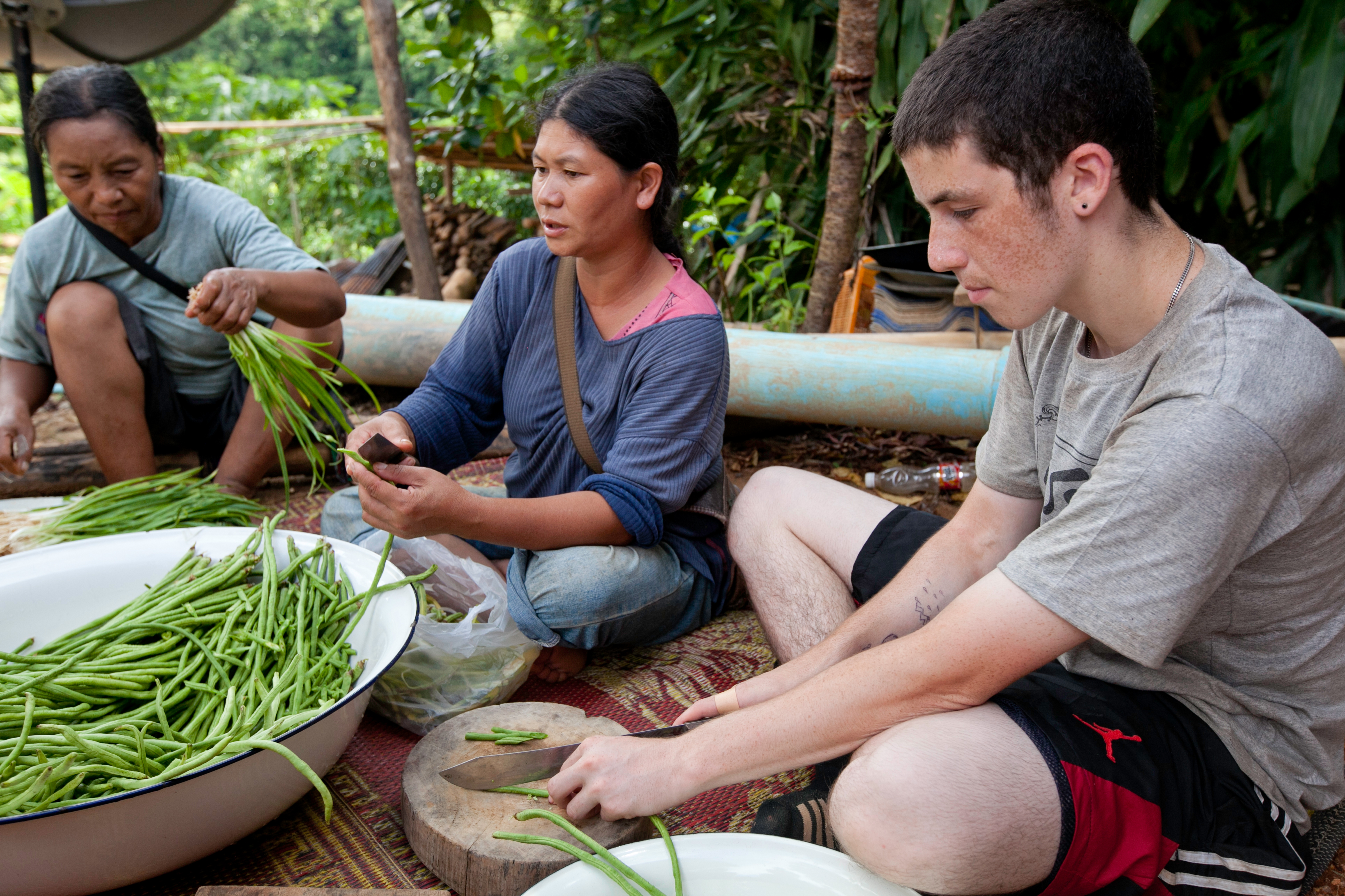 Learn to prepare Laotian food with your homestay family.